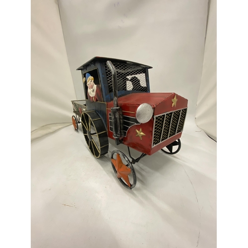 228 - A LARGE TIN PLATE 'SANTA' TRACTOR AND TRAILER, HEIGHT 22CM X 48CM