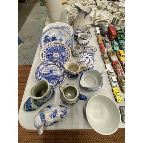 236 - A QUANTITY OF BLUE AND WHITE CERAMICS TO INCLUDE AN ANTIQUE BOOT WITH CREST TO THE BASE, PLATES, JUG... 