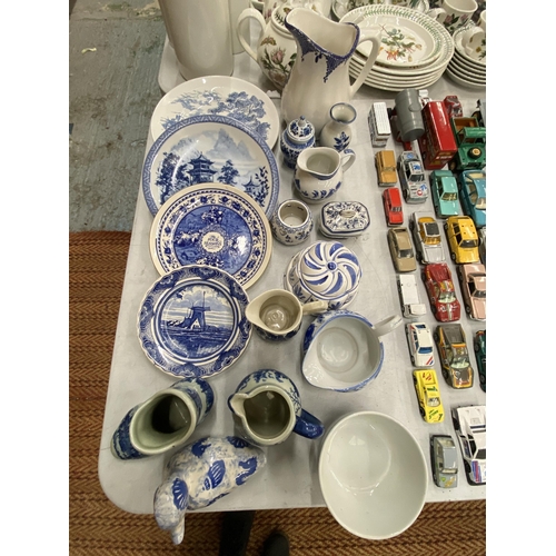 236 - A QUANTITY OF BLUE AND WHITE CERAMICS TO INCLUDE AN ANTIQUE BOOT WITH CREST TO THE BASE, PLATES, JUG... 