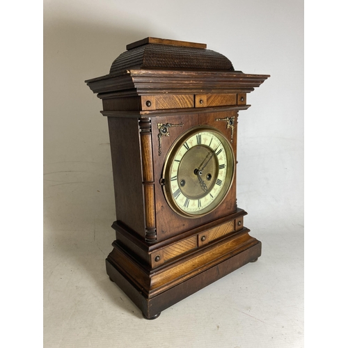 31 - A REGENCY MAHOGANY MANTLE CLOCK WITH BRASS INLAY