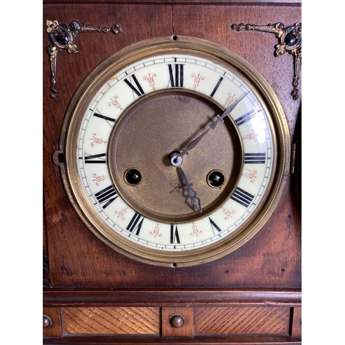 31 - A REGENCY MAHOGANY MANTLE CLOCK WITH BRASS INLAY