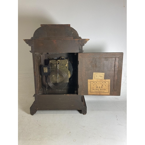 31 - A REGENCY MAHOGANY MANTLE CLOCK WITH BRASS INLAY