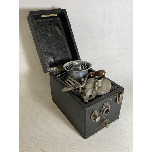 33 - A PETER PAN GRAMOPHONE WITH FOLDING RECORD PLATFORM AND COLLAPSING ALLOY HORN