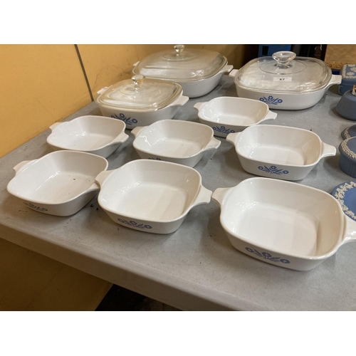 67 - THREE CORNINGWARE BLUE CORNFLOWER CASSEROLE DISHES WITH LIDS TOGETHER WITH SEVEN BOWLS