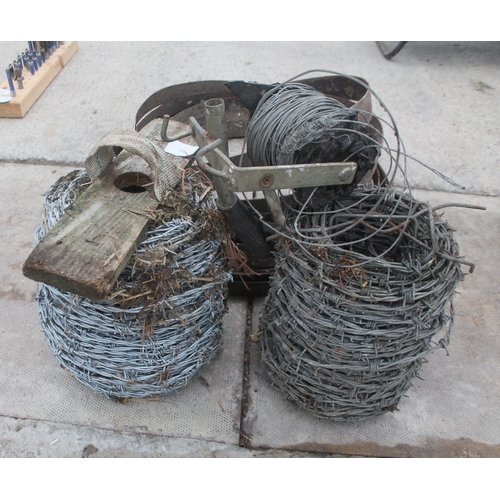 533 - 2 REELS OF BARBED WIRE AND ELECTRIC FENCE WIRE AND COLLECTION OF WOOD RINGS  + VAT