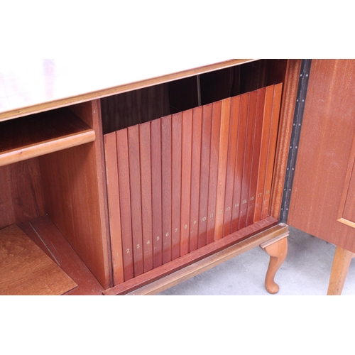 2561 - A RETRO ARNOLD WALNUT RECORD CABINET WITH EIGHTEEN DROP-DOWN STORAGE SECTION ON CABRIOLE LEG, 39.5