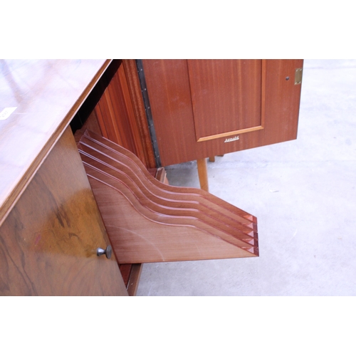 2561 - A RETRO ARNOLD WALNUT RECORD CABINET WITH EIGHTEEN DROP-DOWN STORAGE SECTION ON CABRIOLE LEG, 39.5