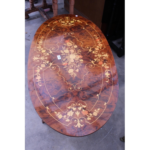 2563 - AN OVAL MARQUETRY INLAID COFFEE TABLE, 44