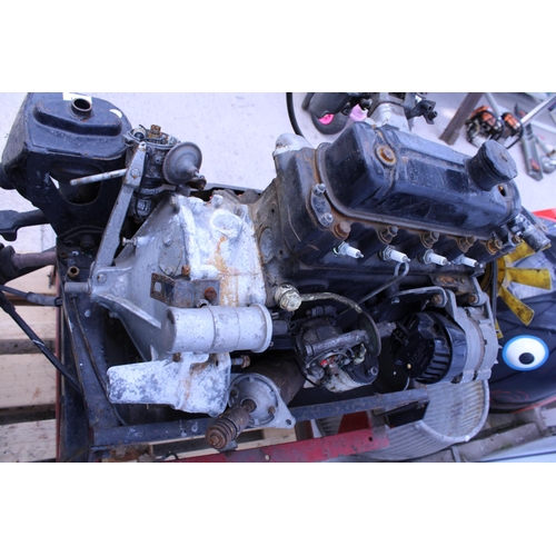 AN AUSTIN MINI STATIONARY ENGINE MOUNTED ON A STAND