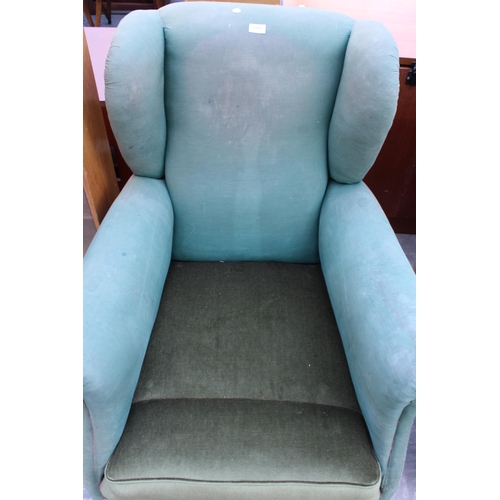 2953 - AN EDWARDIAN SPRUNG AND UPHOLSTERED WINGED EASY CHAIR ON FRONT BUN FEET