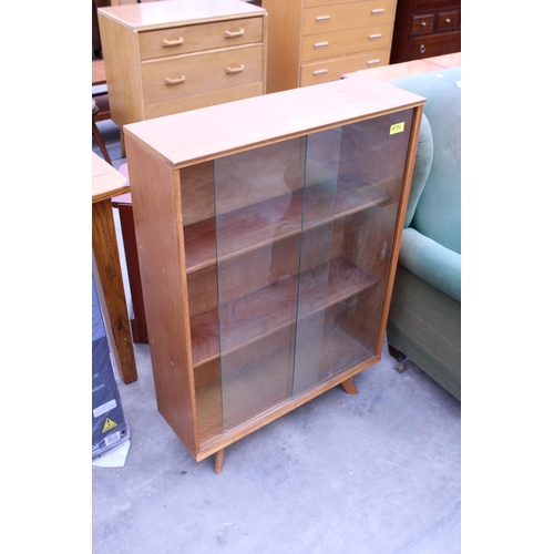 2954 - A MID 20TH CENTURY OAK BOOKCASE WITH TWO GLASS SLIDING DOORS, 28