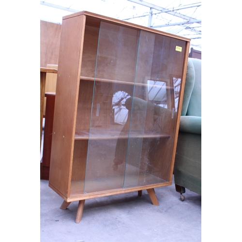 2954 - A MID 20TH CENTURY OAK BOOKCASE WITH TWO GLASS SLIDING DOORS, 28