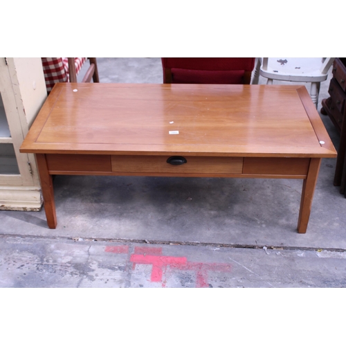 2964 - A HARDWOOD COFFEE TABLE WITH SINGLE PULL TROUGH DRAWER 48