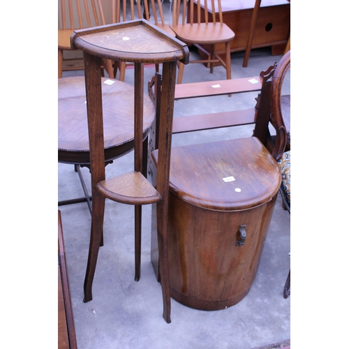 2973 - A WALNUT ART DECO BOW FRONTED CABINET WITH SHELVES AND AN OAK TWO TIER CORNER STAND