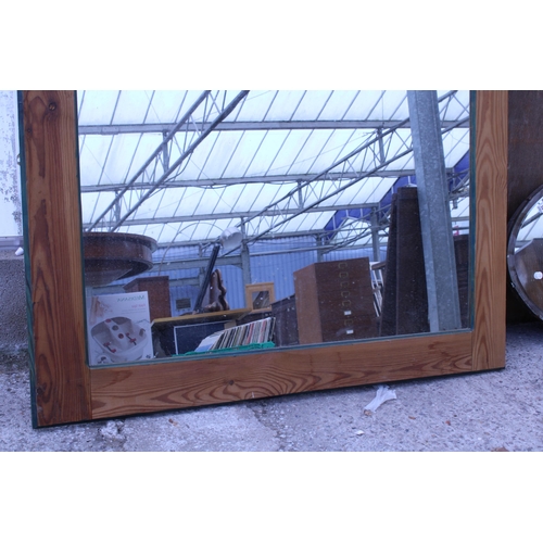 2983 - A PINE FRAMED WALL MIRROR, 44