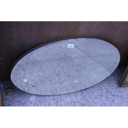 2984 - AN OVAL FRAMELESS WALL MIRROR, 28