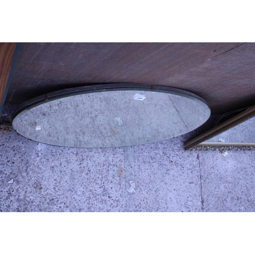 2984 - AN OVAL FRAMELESS WALL MIRROR, 28