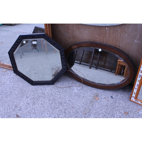 2995 - AN OAK HEXAGONAL WALL MIRROR AND AN OVAL OAK WALL MIRROR