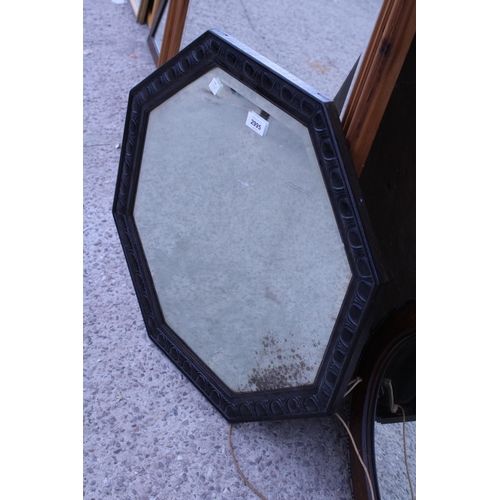 2995 - AN OAK HEXAGONAL WALL MIRROR AND AN OVAL OAK WALL MIRROR