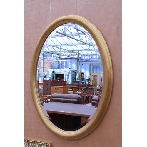 3008 - AN OVAL GILT BOMBAY COMPANY WALL MIRROR WITH BEVEL EDGE, 31