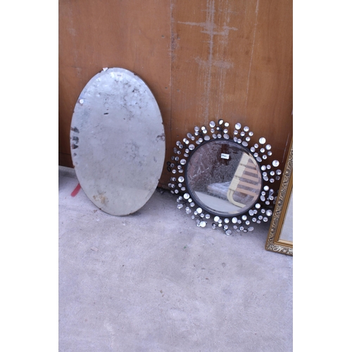 3009 - AN OVAL FRAMELESS WALL MIRROR AND 22