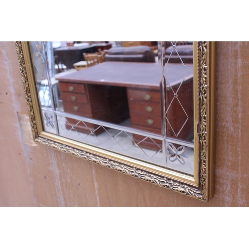 3010 - A GILT EFFECT WALL MIRROR, 32