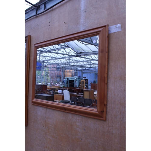 3014 - A PINE FRAMED WALL MIRROR, 35