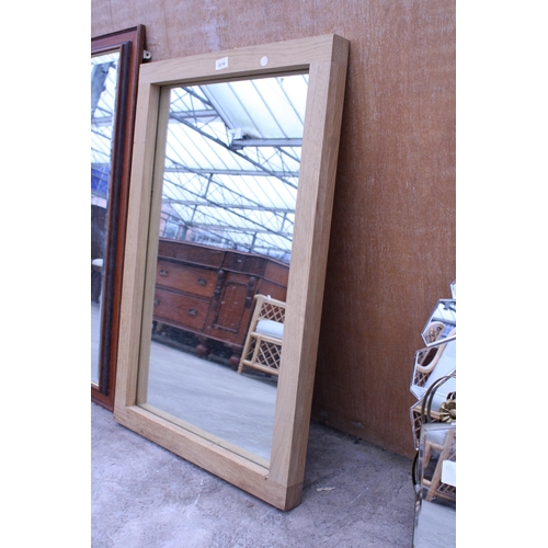 3016 - AN OAK FRAMED WALL MIRROR, 35