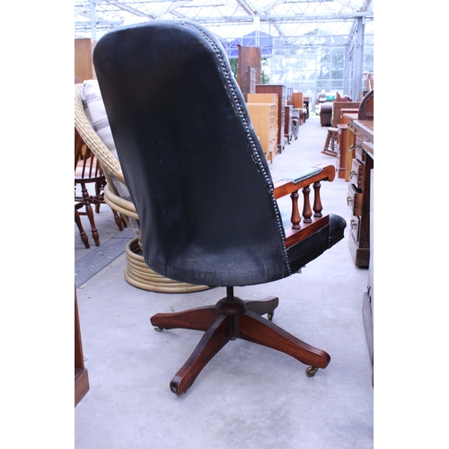 2883 - A GREEN LEATHER SWIVEL DESK CHAIR BEARING LABEL, FAULTLESS-DOERNER, ONTARIO, CANADA