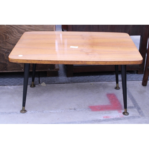 2889 - A MID 20TH CENTURY WALNUT COFFEE TABLE ON BLACK TAPERING LEGS, 24