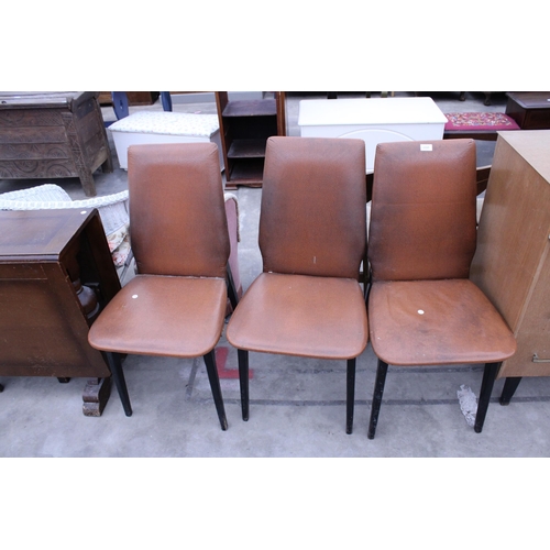 2891 - THREE BROWN FAUX LEATHER DINING CHAIRS ON BLACK PAINTED LEGS