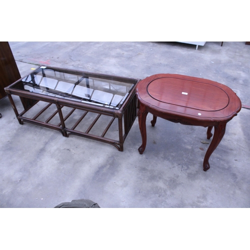 2909 - AN OVAL HARDWOOD COFFEE TABLE AND BAMBOO AND WICKER GLASS TOP COFFEE TABLE