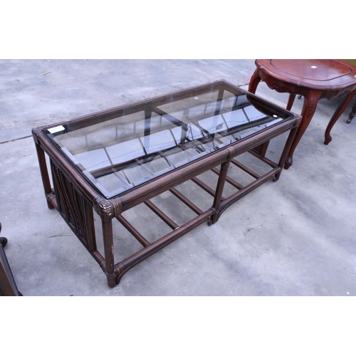 2909 - AN OVAL HARDWOOD COFFEE TABLE AND BAMBOO AND WICKER GLASS TOP COFFEE TABLE