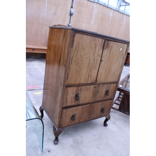 2910 - A MID 20TH CENTURY WALNUT TALLBOY ON CABRIOLE LEGS, 27