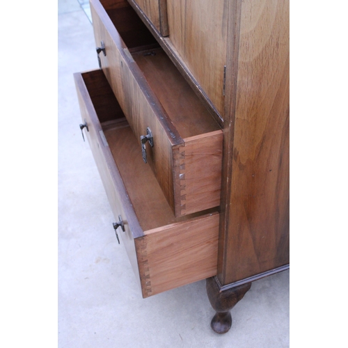 2910 - A MID 20TH CENTURY WALNUT TALLBOY ON CABRIOLE LEGS, 27