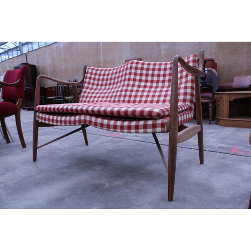 2913 - A RETRO TEAK DANISH STYLE TWO SEATER SETTEE WITH SHAPED OPEN ARMS