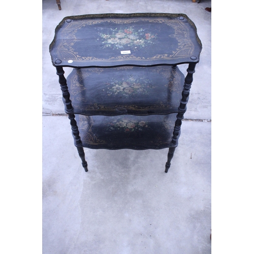 2917 - A VICTORIAN STYLE THREE TIER BLACK PAINTED WHAT NOT WITH FLORAL PAINTED DECORATION AND EMBOSSED BRAS... 