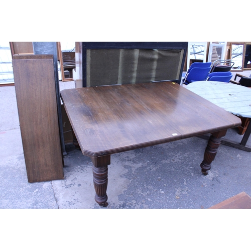 2940 - A LATE VICTORIAN OAK WIND-OUT DINING TABLE ON TURNED LEGS WITH CANTED CORNERS, 57