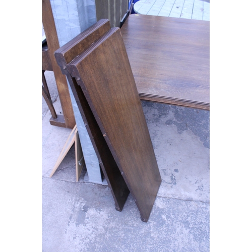 2940 - A LATE VICTORIAN OAK WIND-OUT DINING TABLE ON TURNED LEGS WITH CANTED CORNERS, 57