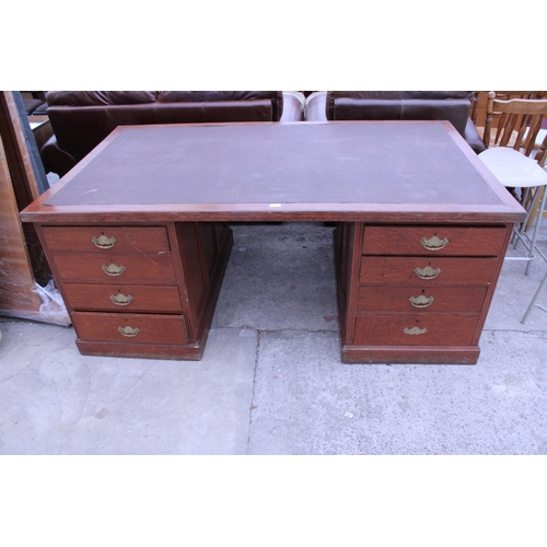 2946 - AN EDWARDIAN OAK TWIN PEDESTAL DESK ENCLOSING EIGHT DRAWERS WITH INSET LEATHER EFFECT TOP, 72