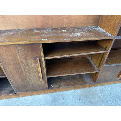 3020 - A RANGE OF THREE MID 20TH CENTURY OAK STORAGE SHELVES ENCLOSING CUPBOARDS, TWO SECTIONS BEING 40.5