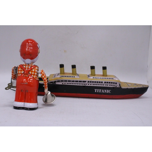 239 - TWO TIN PLATE TOYS TO INCLUDE A CLOCKWORK SANTA AND THE TITANIC