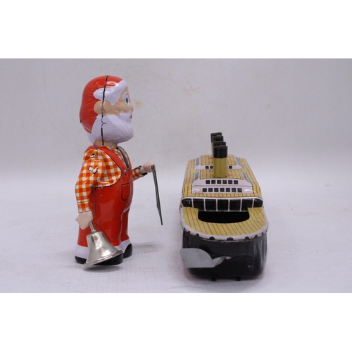 239 - TWO TIN PLATE TOYS TO INCLUDE A CLOCKWORK SANTA AND THE TITANIC