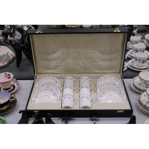 262 - A SET OF ROYAL DOULTON 'ANGELIQUE' COFFEE CANS AND SAUCERS IN A PRESENTATION BOX