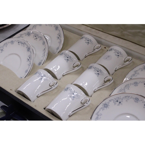 262 - A SET OF ROYAL DOULTON 'ANGELIQUE' COFFEE CANS AND SAUCERS IN A PRESENTATION BOX