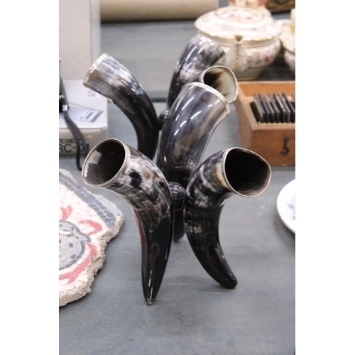 271 - A PAIR OF VASES, EACH CONTAINING THREE HORNS WITH POSSIBLY SILVER RIMS, HEIGHT 20CM