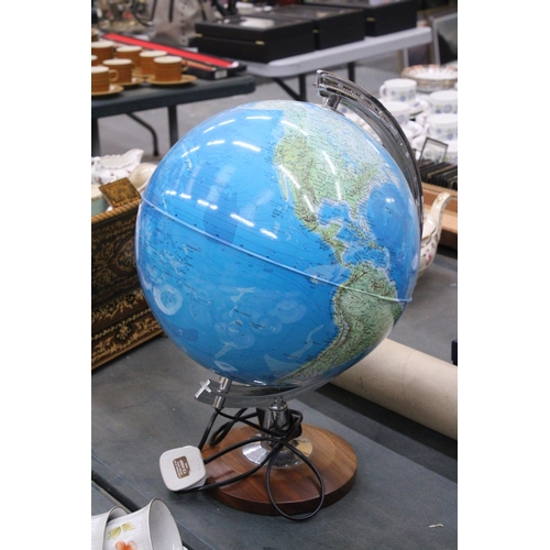 279 - AN ILLUMINATED WORLD GLOBE ON A WOODEN BASE - WORKING AT TIME OF CATALOGUING, NO WARRANTY GIVEN