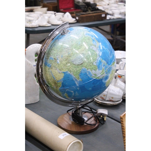 279 - AN ILLUMINATED WORLD GLOBE ON A WOODEN BASE - WORKING AT TIME OF CATALOGUING, NO WARRANTY GIVEN