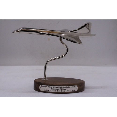 291 - A CHROME CONCORDE ON A WOODEN BASE, HEIGHT 18CM