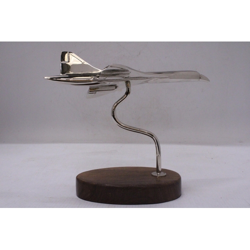 291 - A CHROME CONCORDE ON A WOODEN BASE, HEIGHT 18CM